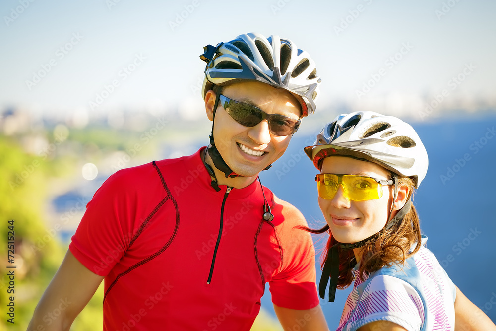 happy couple on bicycles happy couple on bicycles