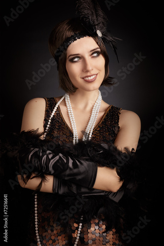 Bilde på lerret Beautiful retro woman from the roaring 20s ready to party