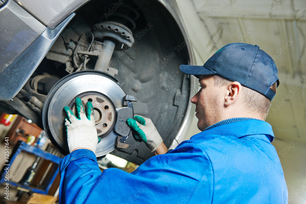 auto mechanic at car suspension repairing auto mechanic at car suspension repairing