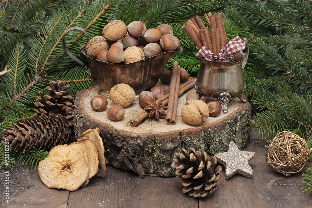 Chistmas composition with cinnamon, nuts and fir branches. Chistmas composition with cinnamon, nuts and fir branches.
