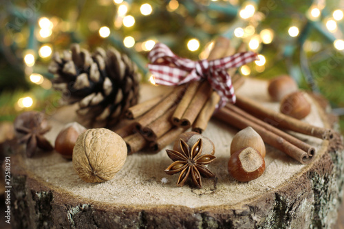 Chistmas composition with cinnamon, nuts and fir branches.