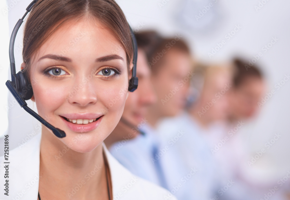 Close-up portrait of a customer service agent sitting at office Close-up portrait of a customer service agent sitting at office