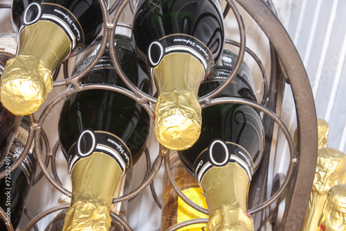 Champagne bottles, on a wine rack