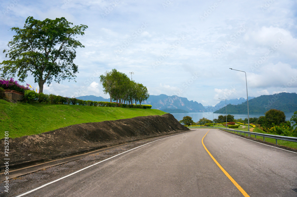 Road leading to the lake with mountains