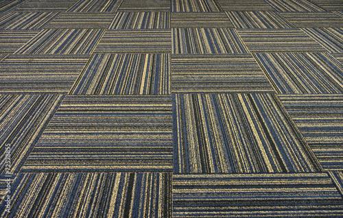Fotografie The dark pattern of carpet on a floor