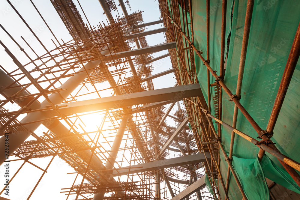 Silhouettes of scaffolding on sunset