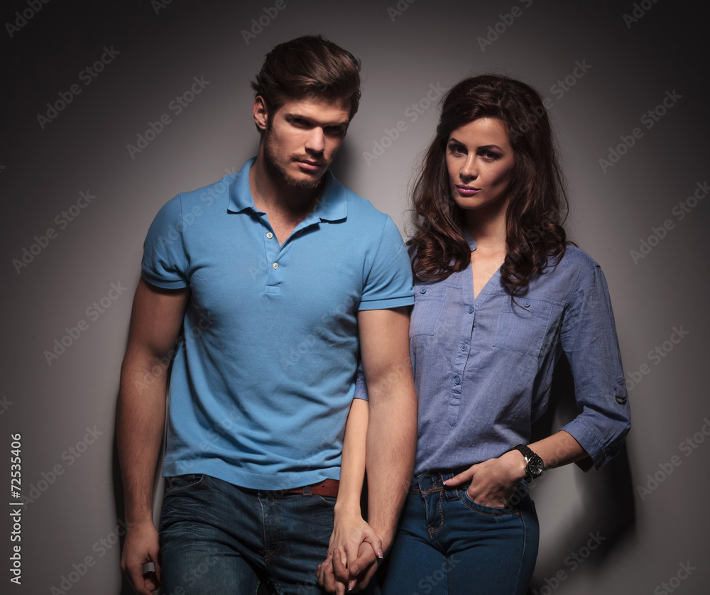 Cute fashion couple looking at the camera Cute fashion couple looking at the camera