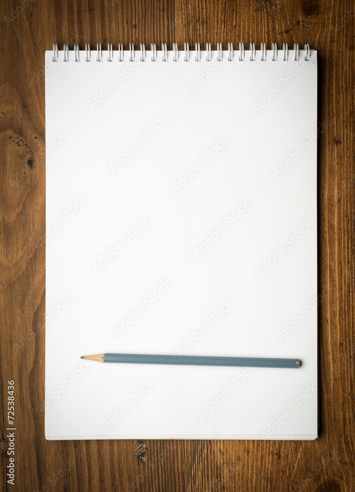 notebook with pencile on a wooden notebook with pencile on a wooden