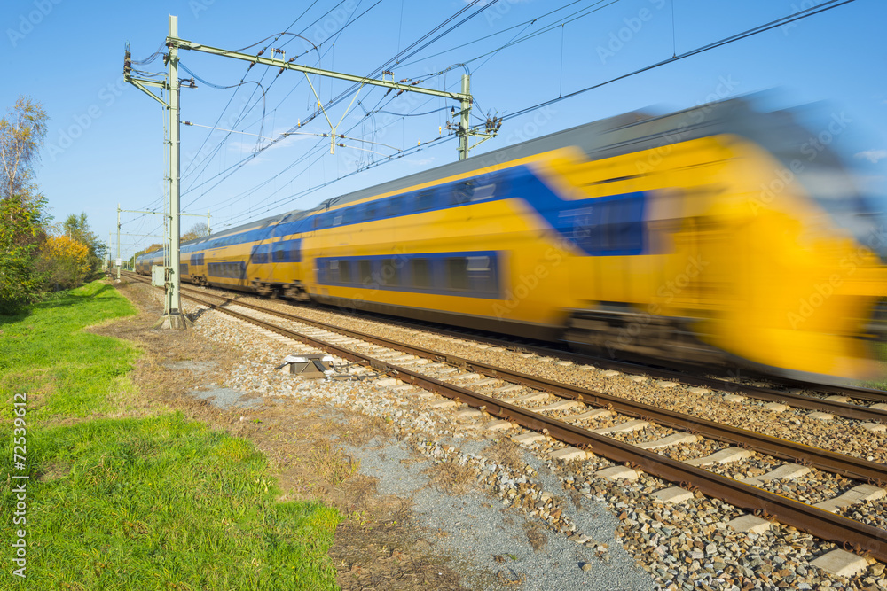 Fototapeta premium Passenger train moving at high speed
