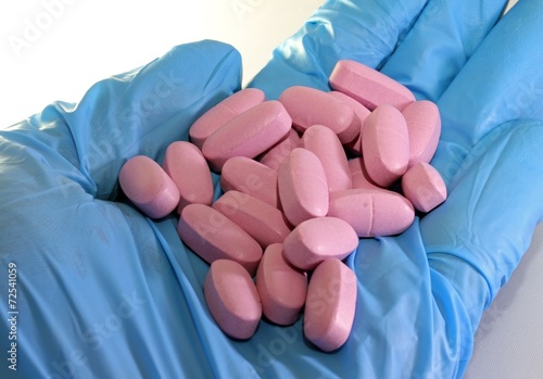 Blue glove with pink pads for toxicity testing in the pharmaceut