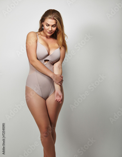 Attractive plus size young lady in body stocking