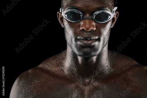 Young african man with swimming goggles