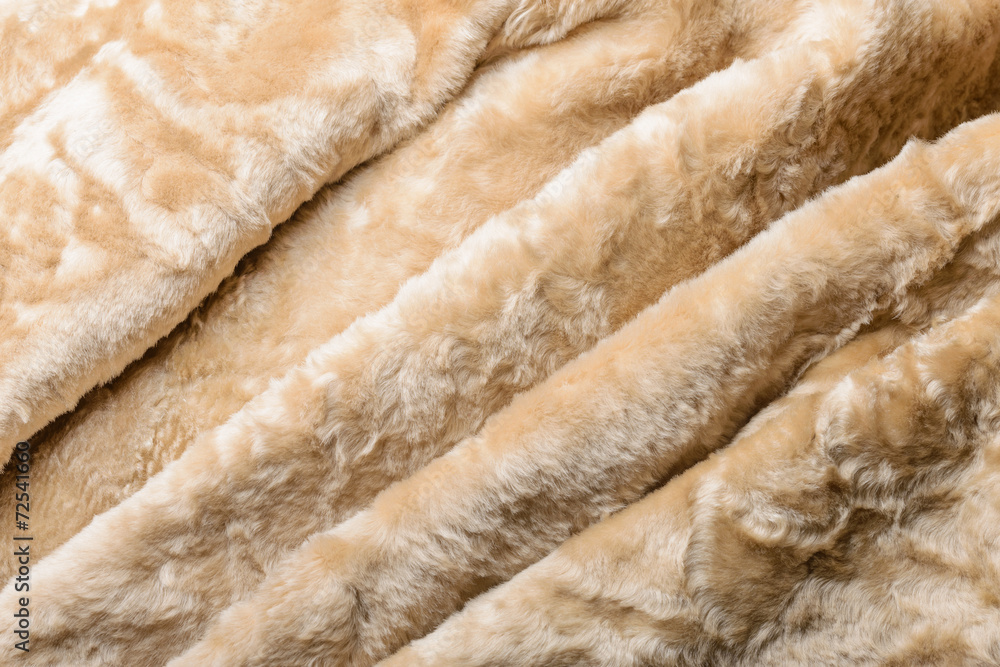 Folds and waves in a warm blond sheepskin Jacket Folds and waves in a warm blond sheepskin Jacket
