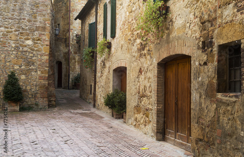 Fototapeta Naklejka Na Ścianę i Meble -  Old street and doors in an old town from Tuscany
