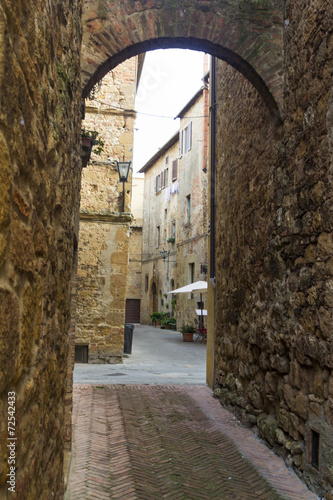 Arch on a street in an old town from Tuscany