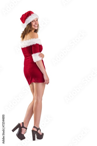 Pretty girl in santa outfit smiling at camera