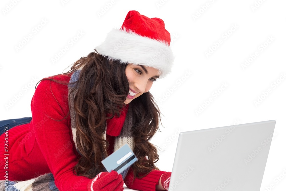 Happy brunette shopping online with laptop Happy brunette shopping online with laptop