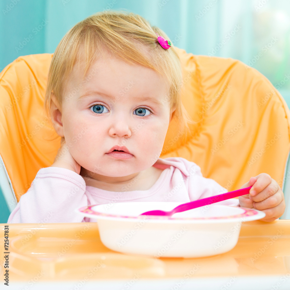 one year old girl in a highchair for feeding one year old girl in a highchair for feeding