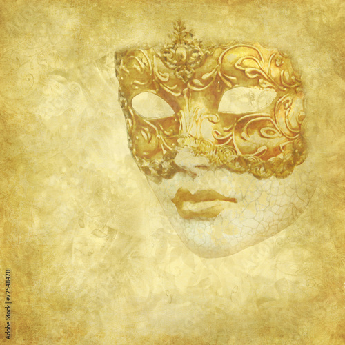 Golden Venetian mask on floral grunge texture