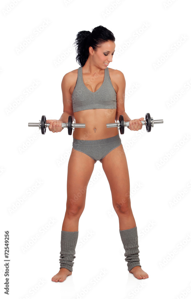 Attractive girl training with dumbbells
