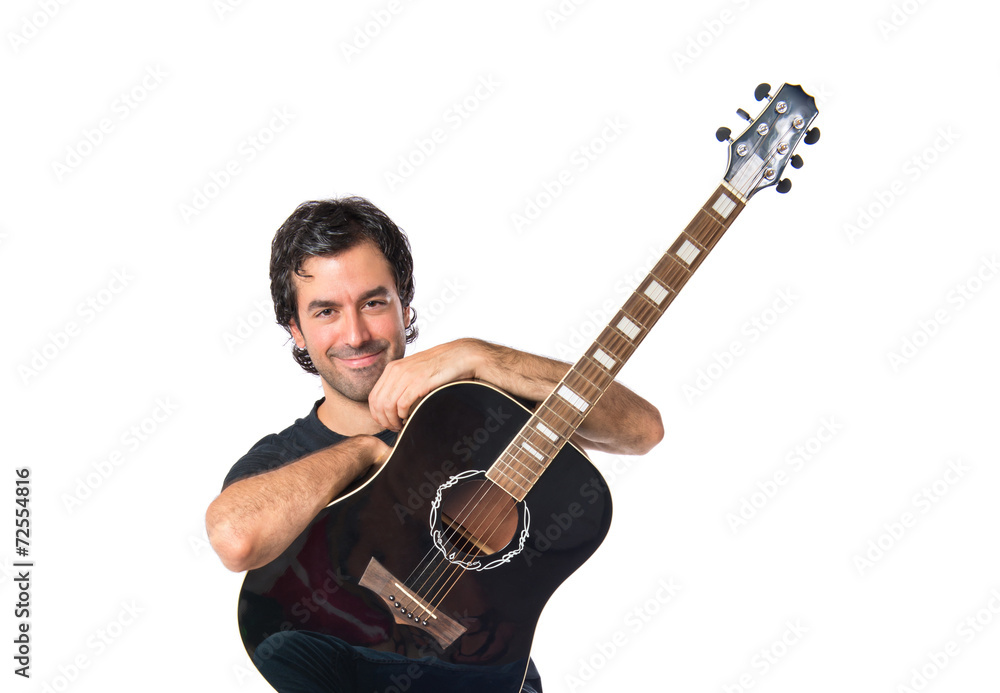 Handsome man with guitar over white background Handsome man with guitar over white background