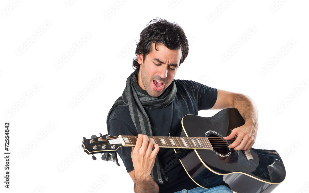 Obraz premium Handsome man with guitar over white background