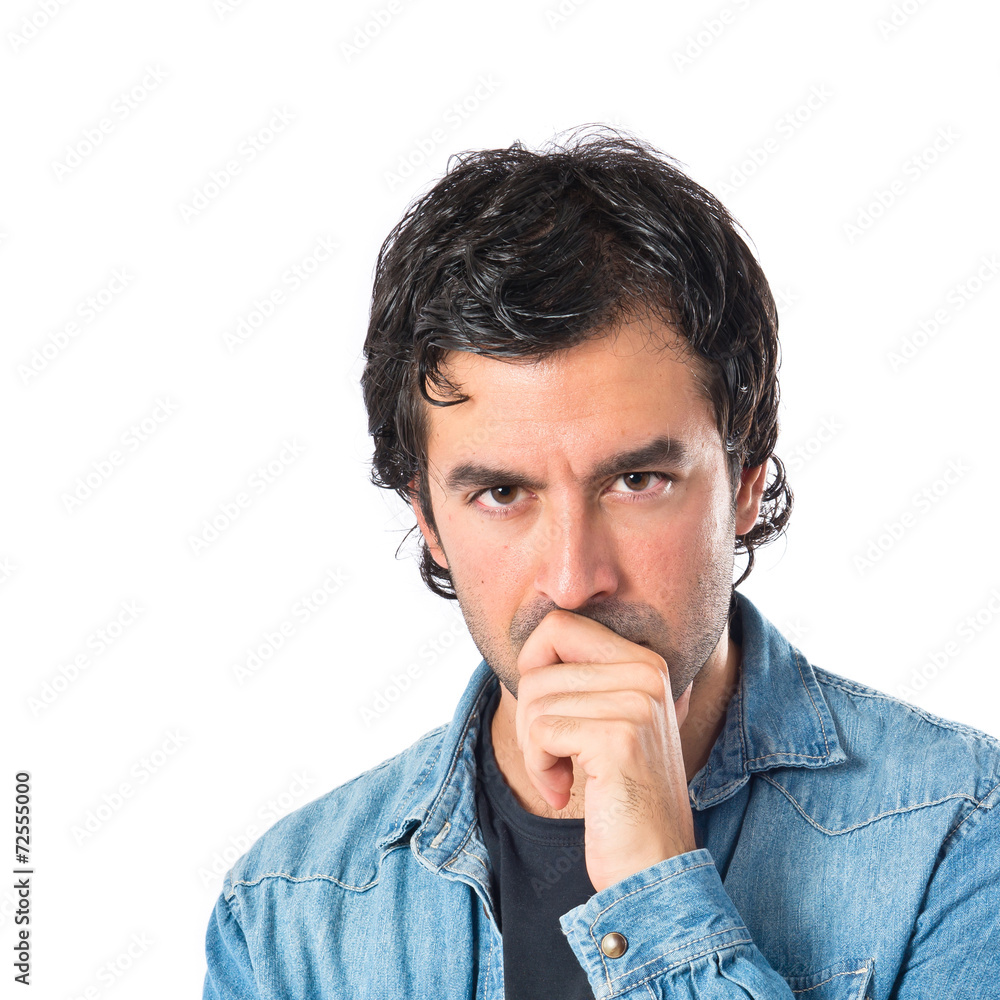 Brunette man thinking over isolated white background Brunette man thinking over isolated white background