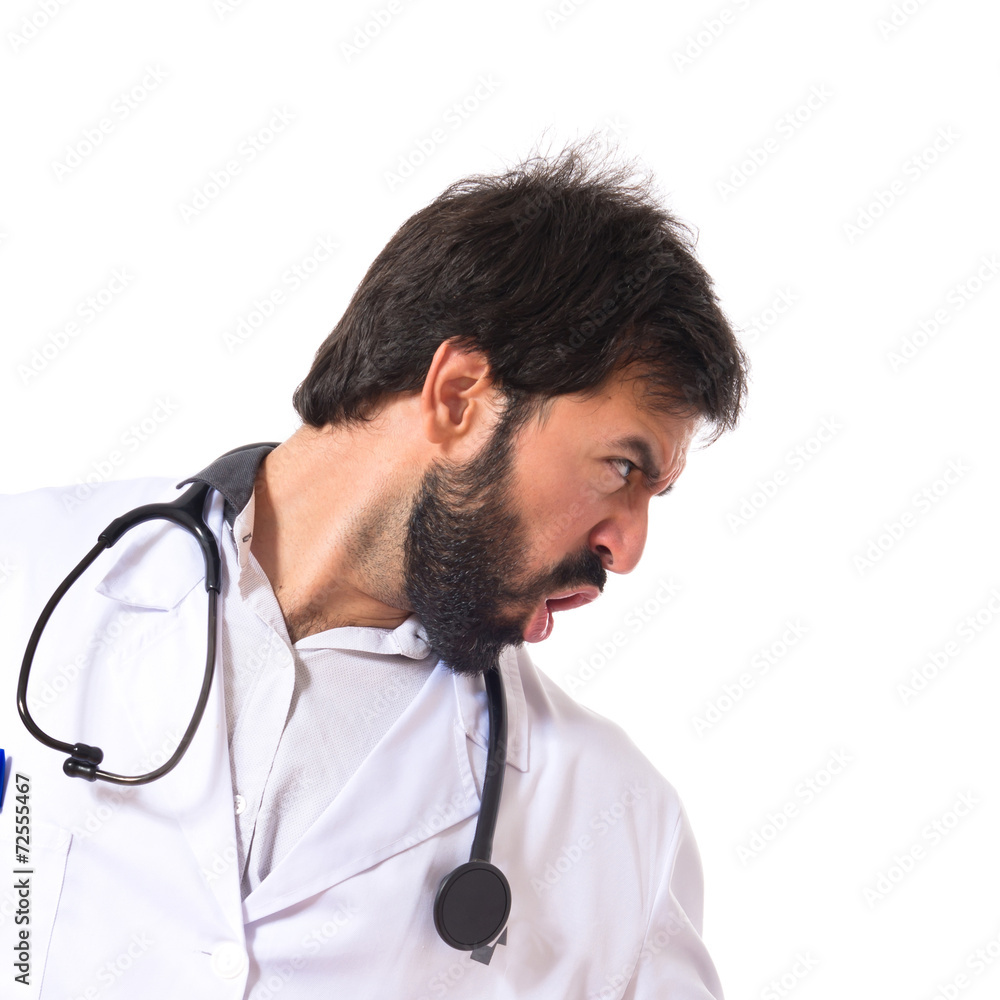 Doctor shouting over isolated white background Doctor shouting over isolated white background