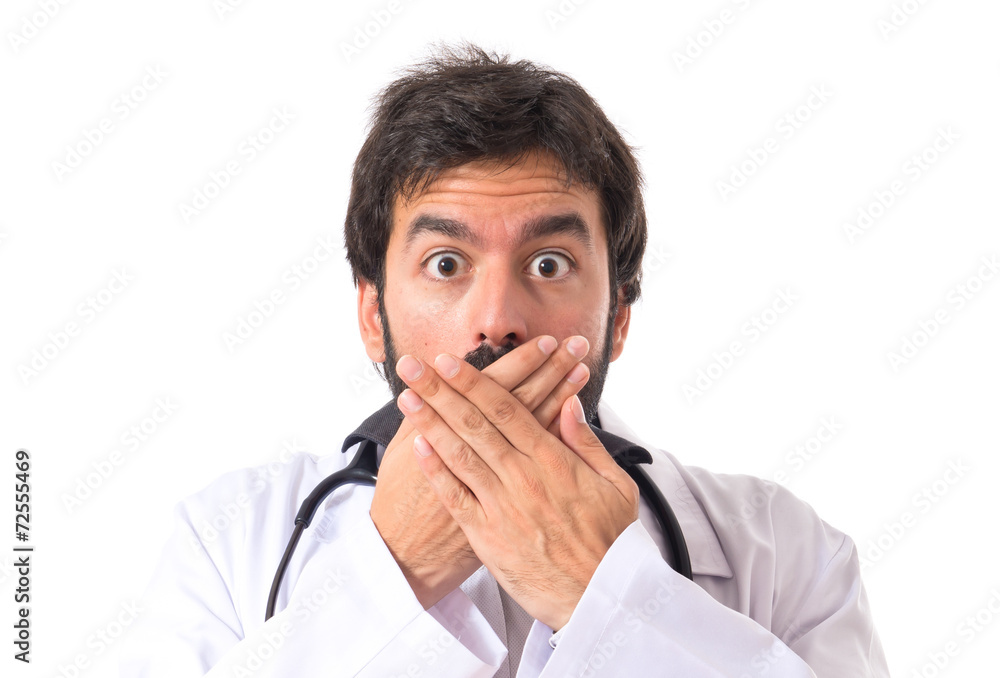 Doctor doing surprise gesture over white background Doctor doing surprise gesture over white background