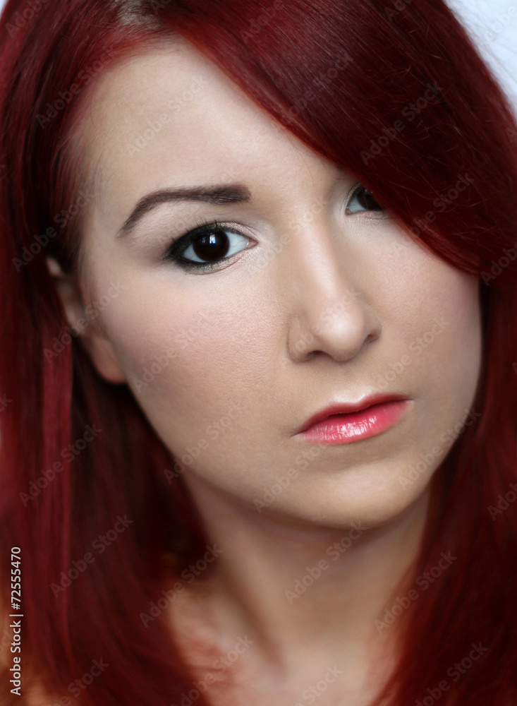 Beautiful redhead young woman with bright make up portrait Beautiful redhead young woman with bright make up portrait