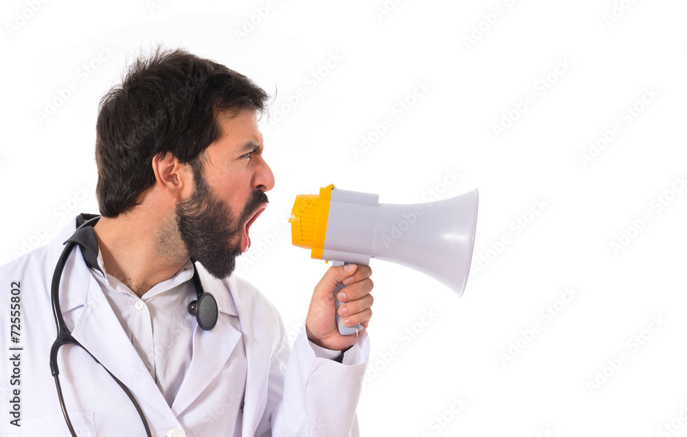 Doctor shouting over isolated white background Doctor shouting over isolated white background