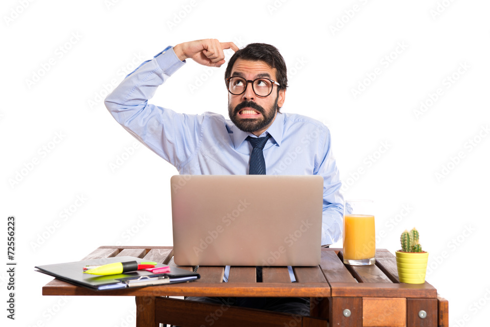 Businessman in his office thinking over white background Businessman in his office thinking over white background