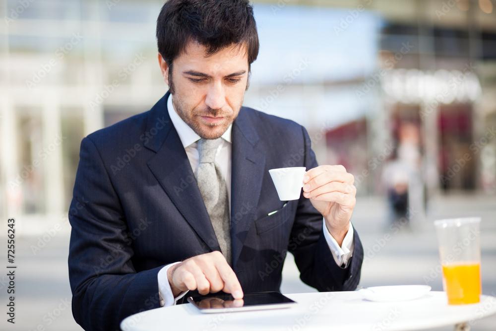 Businessman reading his digital tablet Businessman reading his digital tablet