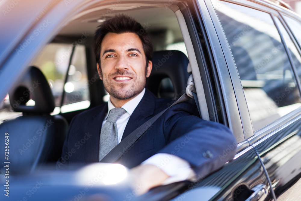 Handsome man driving his car