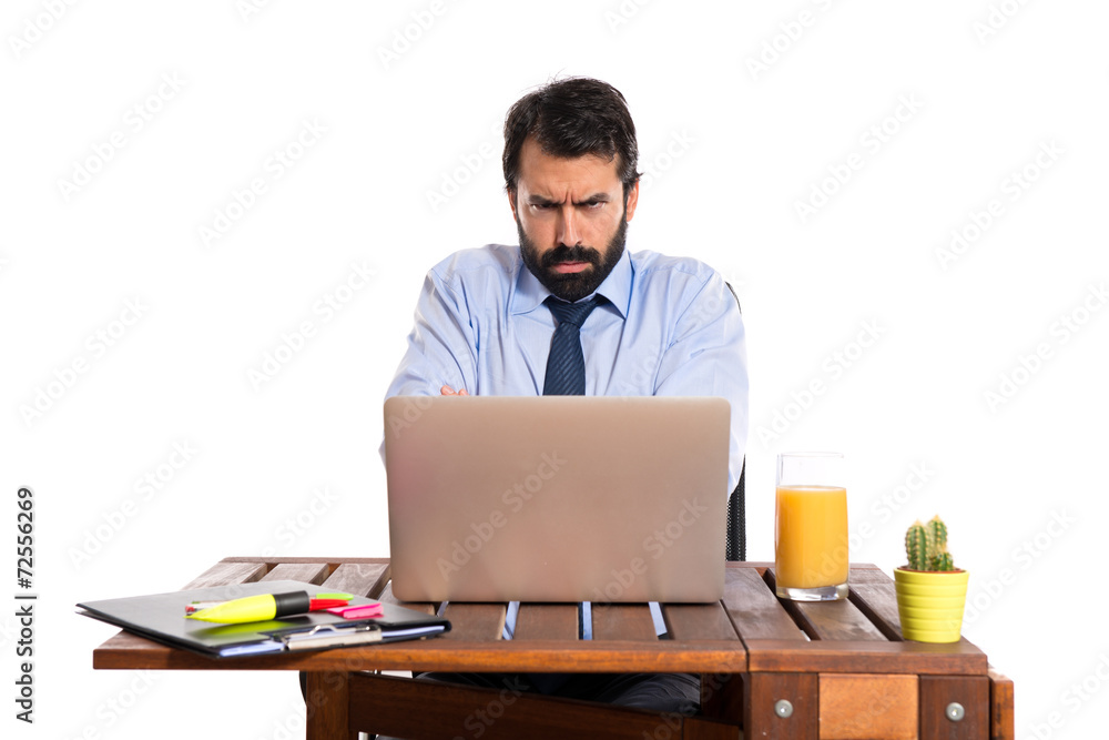 Sad Businessman working with his laptot Sad Businessman working with his laptot