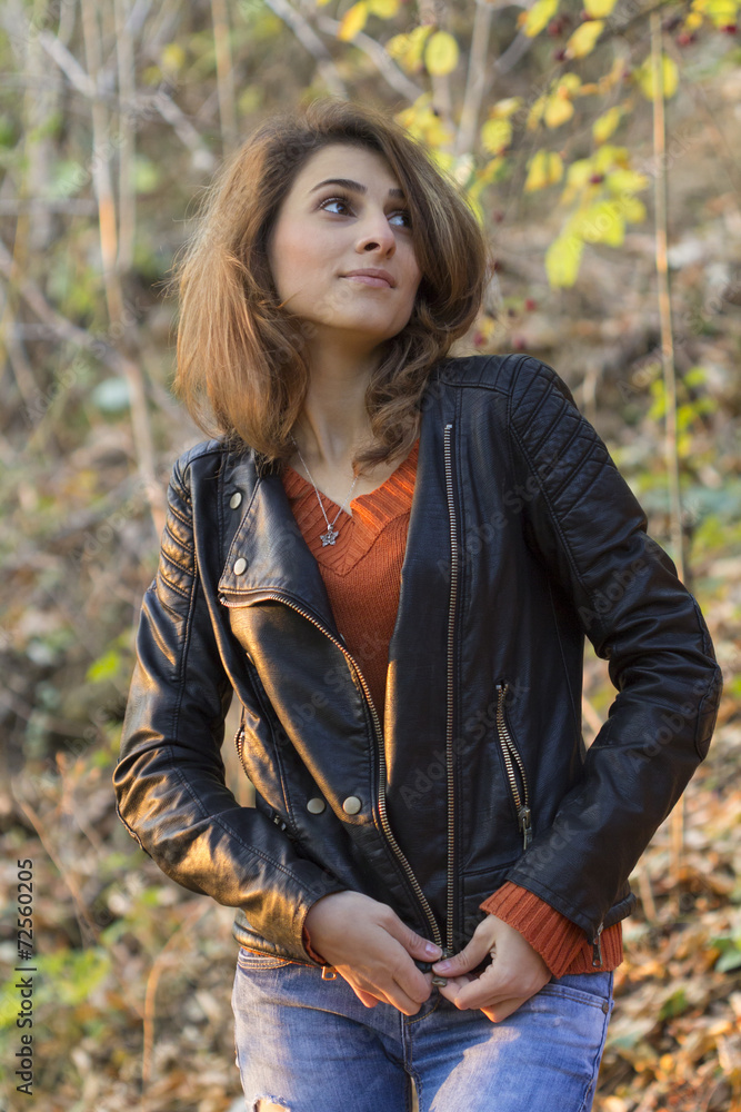 Beautiful woman in autumn park looking up Beautiful woman in autumn park looking up