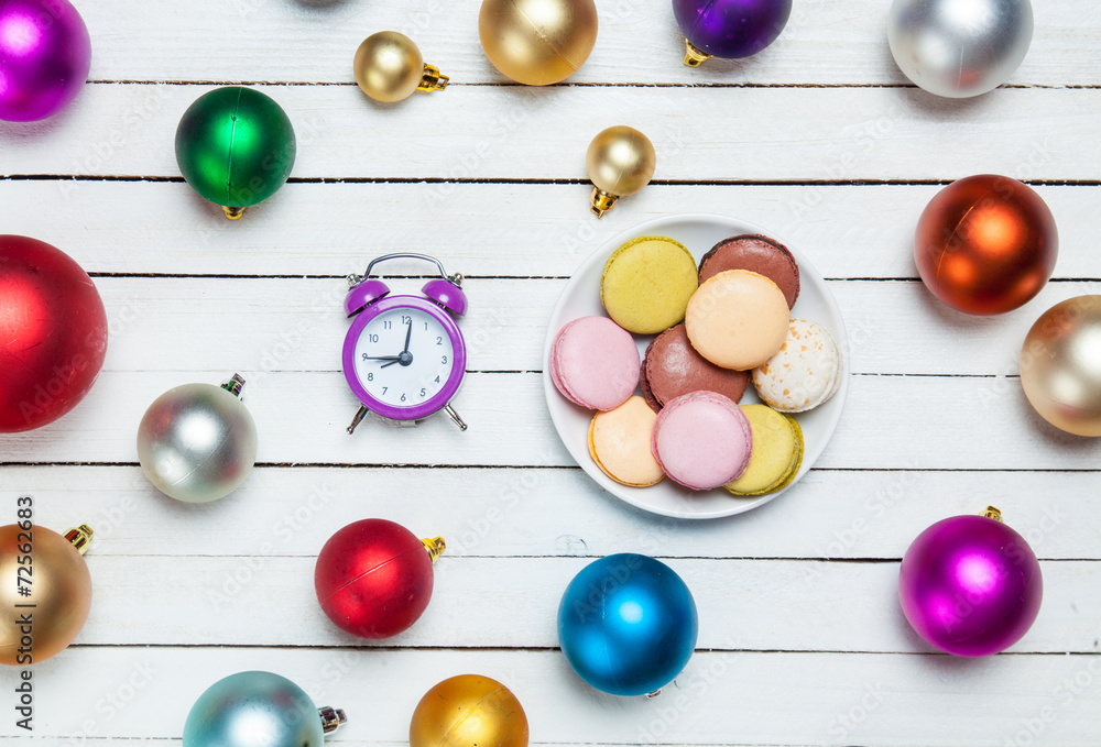 Clock and cookies with christmas toys.