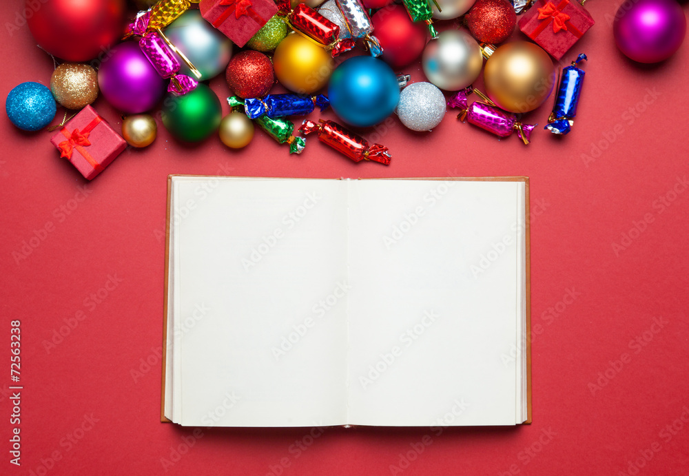 Book and chritmas toys on white background. Book and chritmas toys on white background.