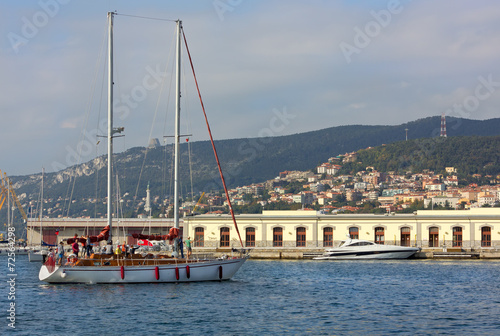 Sailboat in front of Trieste Port, Italy