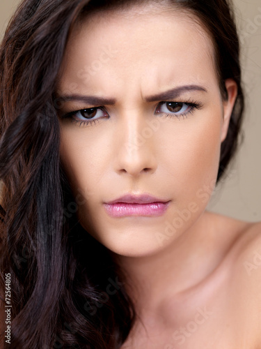 Attractive woman with a puzzled frown