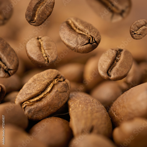 Closeup of coffee beans with focus on one