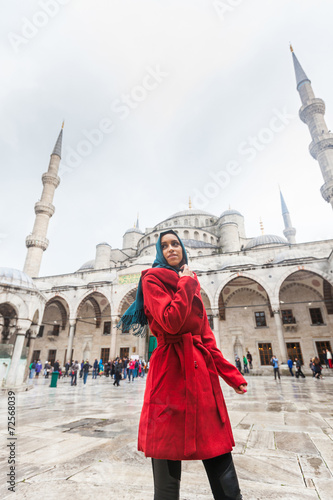 Photography Young Arabian Woman wearing Veil in front of a Mosque