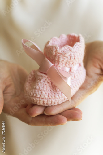 Hands holding a bootie