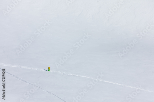 Snowboarder in wintertime at snow resort of Gudauri, Georgia