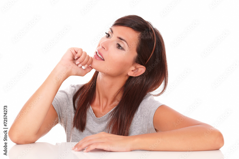 Pensive adult female wondering and looking up Pensive adult female wondering and looking up