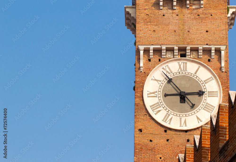 Closeup view of tower clock of Lamberti Tower at right side