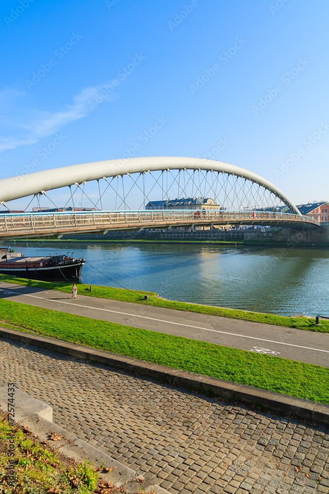 Bernatka bridge over Vistula river on sunny day, Krakow, Poland