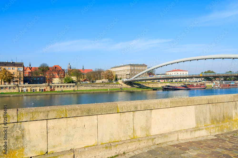 Fototapeta premium Bernatka bridge over Vistula river on sunny day, Krakow, Poland