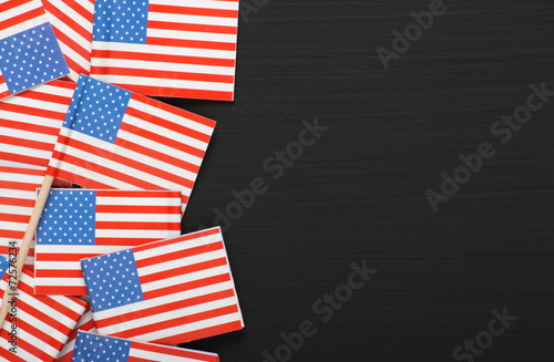 Miniature USA flags on a blackboard with copy space