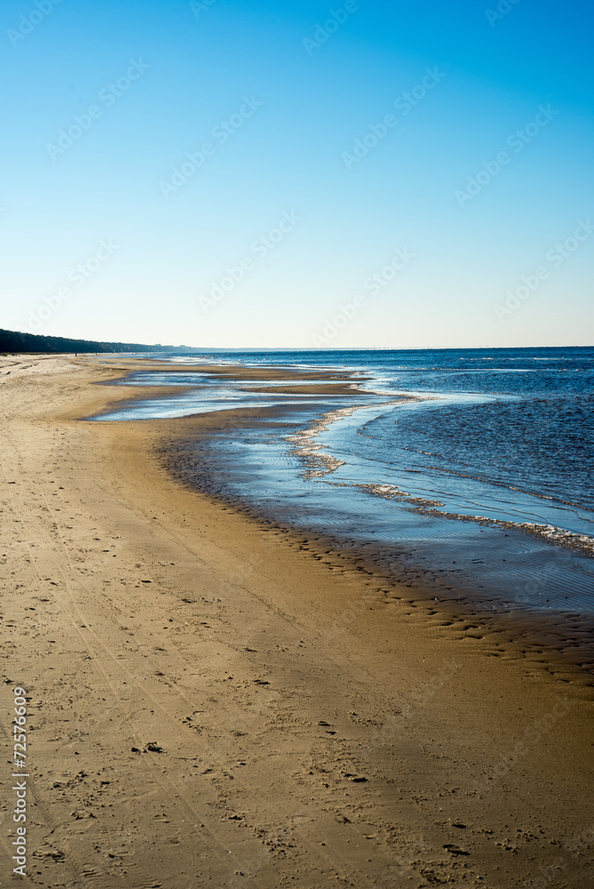 icy sea beach with first ice pieces